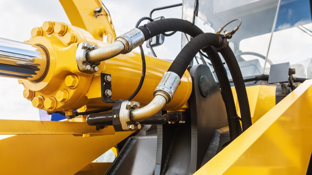 Hydraulics,Tractor,Yellow.,Focus,On,The,Hydraulic,Pipes